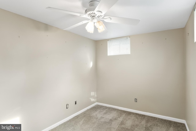 carpeted empty room featuring ceiling fan