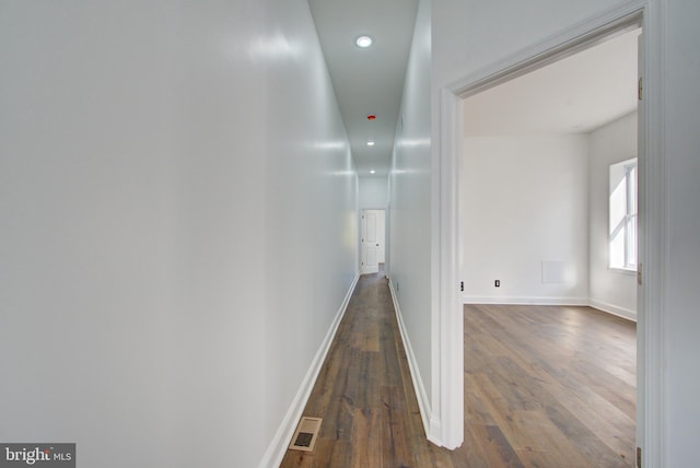 hall with dark hardwood / wood-style floors