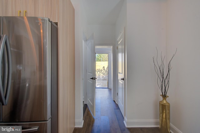 corridor with dark hardwood / wood-style floors