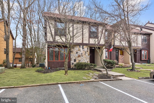 215 Keats Ct, Sicklerville, NJ 08081 - townhome / multi-family property with central air condition unit, a front yard, uncovered parking, and stone siding