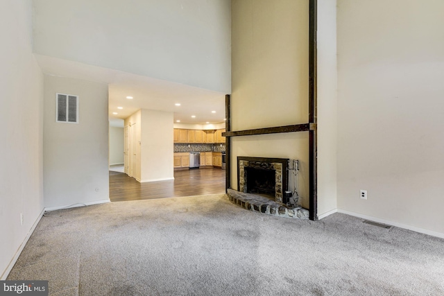 unfurnished living room featuring carpet flooring