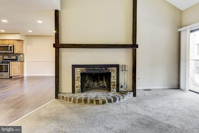 unfurnished living room with hardwood / wood-style floors and a fireplace