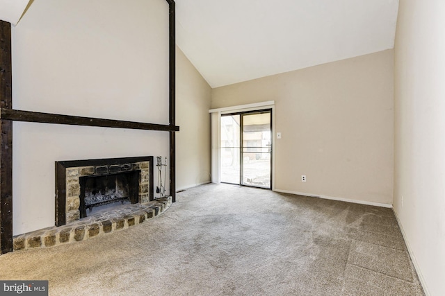 unfurnished living room featuring a stone fireplace, high vaulted ceiling, and carpet flooring