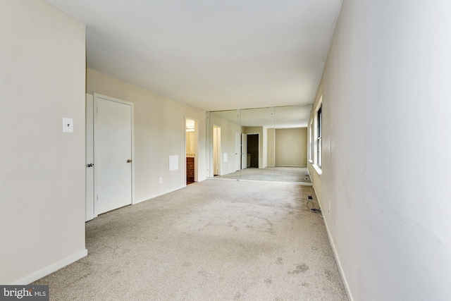 empty room with light colored carpet