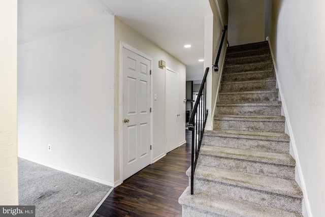 staircase featuring hardwood / wood-style floors