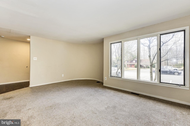 empty room featuring carpet flooring