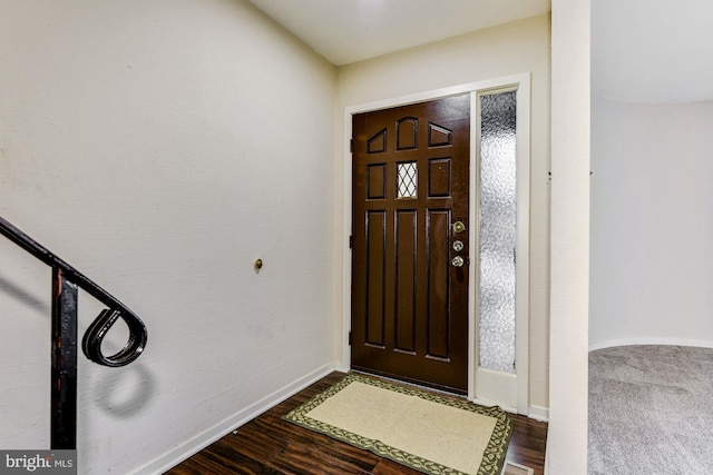 entryway with hardwood / wood-style floors