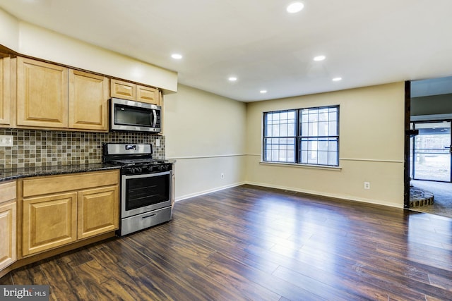 kitchen featuring appliances with stainless steel finishes, decorative backsplash, dark hardwood / wood-style floors, and light brown cabinets