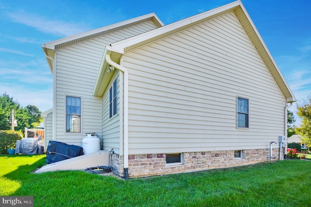 view of home's exterior with a yard