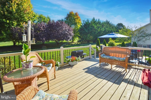 wooden deck featuring a yard