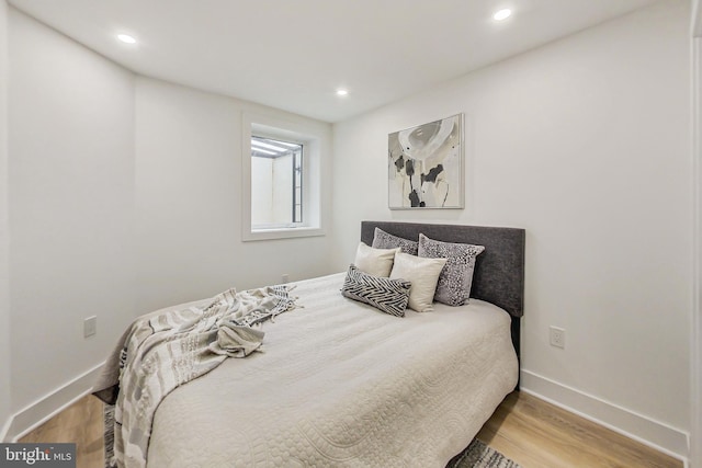 bedroom with light wood-type flooring