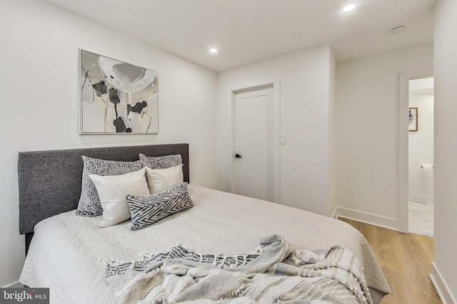 bedroom with light hardwood / wood-style flooring