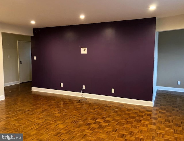 empty room featuring dark parquet floors