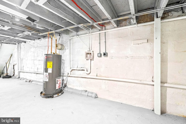 unfinished basement featuring water heater