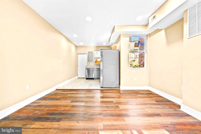 unfurnished living room featuring light hardwood / wood-style flooring