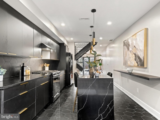 kitchen featuring decorative backsplash, wall chimney exhaust hood, a kitchen breakfast bar, hanging light fixtures, and black appliances