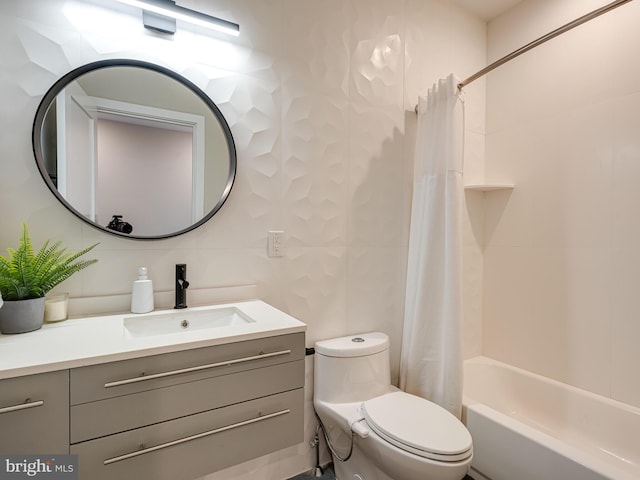 full bathroom with tile walls, vanity, shower / tub combo with curtain, and toilet