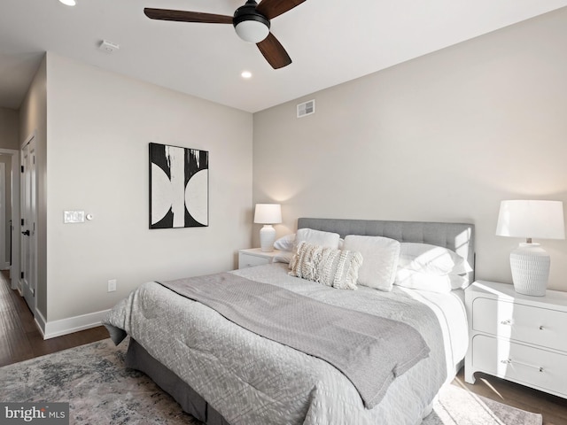 bedroom featuring ceiling fan and dark hardwood / wood-style flooring