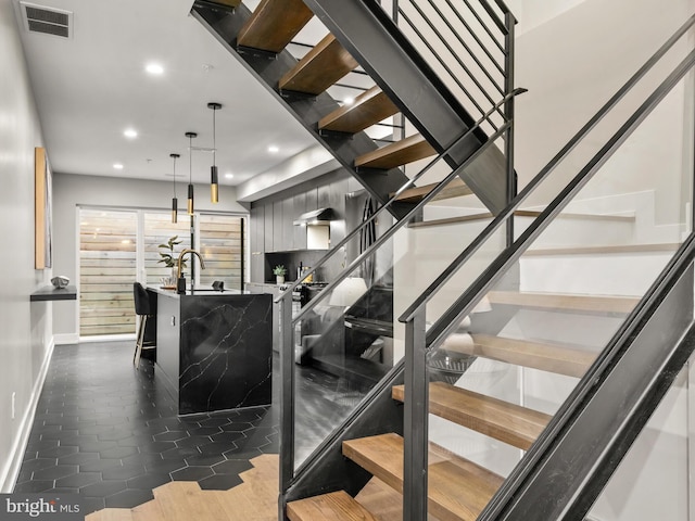 staircase featuring hardwood / wood-style flooring