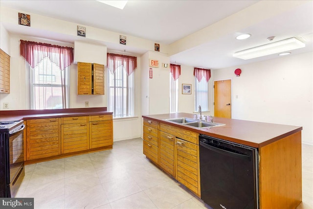 2072 E Clearfield St, Philadelphia, PA 19134 - kitchen featuring an island with sink, electric range oven, dishwasher, a sink, and light tile patterned flooring