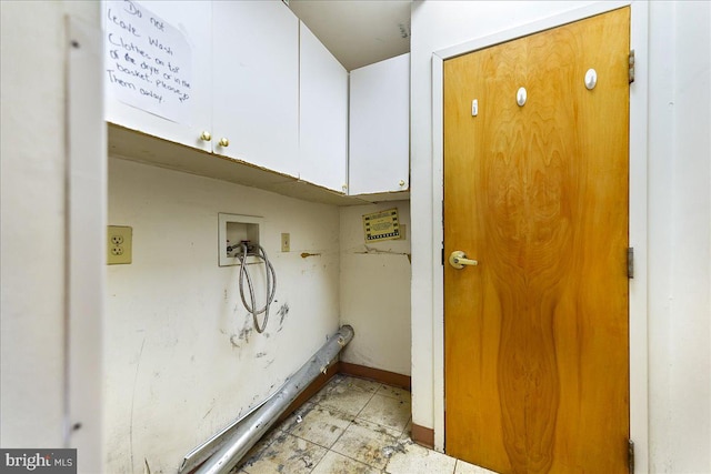 clothes washing area with hookup for a washing machine and cabinets