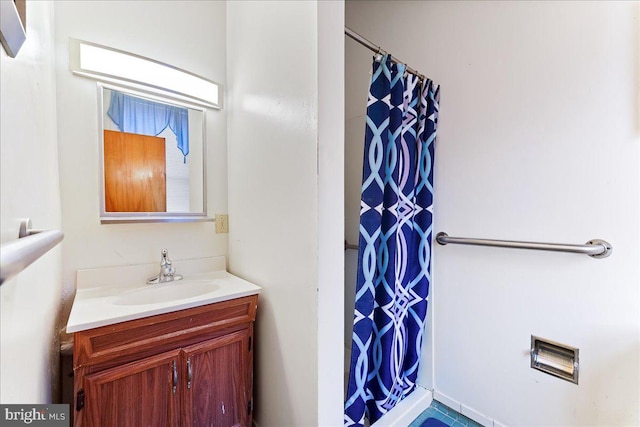 bathroom featuring vanity and a shower with shower curtain