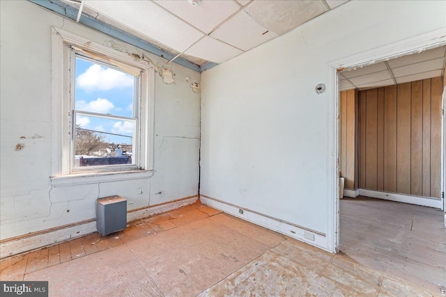 2072 E Clearfield St, Philadelphia, PA 19134 - empty room featuring baseboards, wood walls, and a paneled ceiling