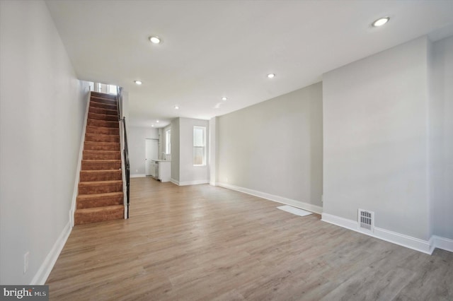 spare room with light hardwood / wood-style flooring