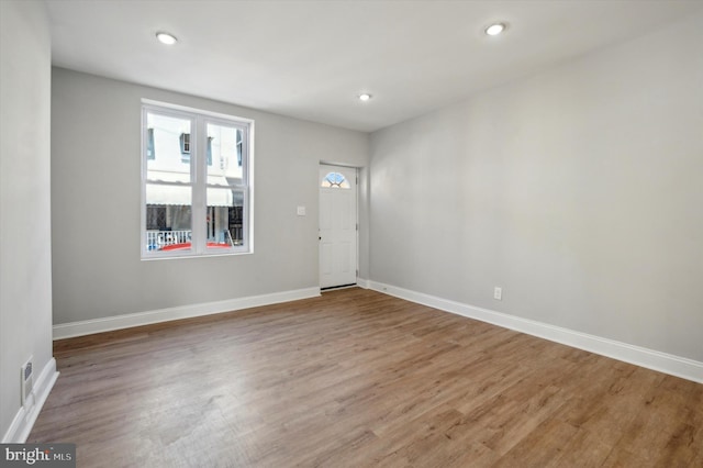 spare room with hardwood / wood-style flooring