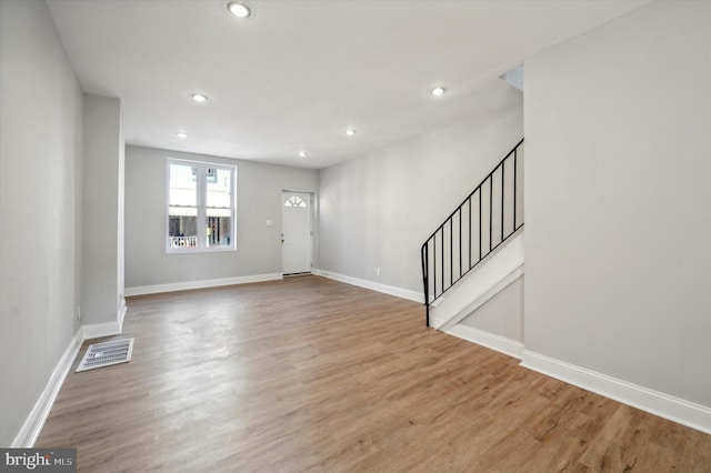 entryway with light hardwood / wood-style flooring