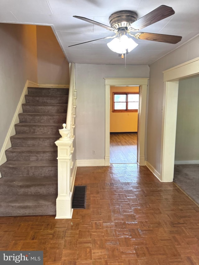 stairs with ceiling fan