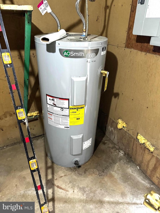 utility room with electric water heater