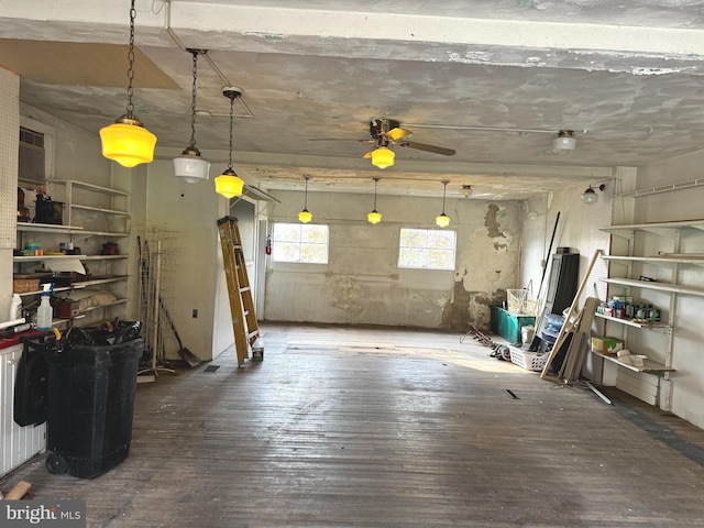 misc room featuring ceiling fan and dark hardwood / wood-style flooring