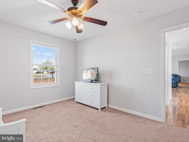 interior space with light wood-type flooring and ceiling fan