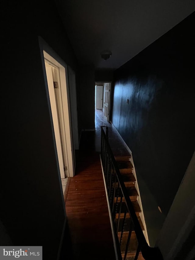 hallway featuring dark wood-type flooring