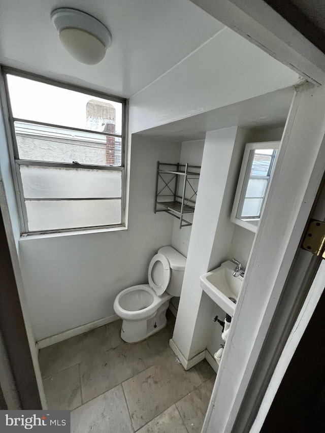 bathroom with toilet and sink