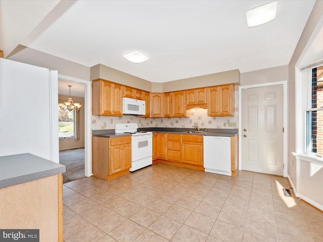 kitchen featuring a notable chandelier, decorative backsplash, light tile patterned flooring, and white appliances