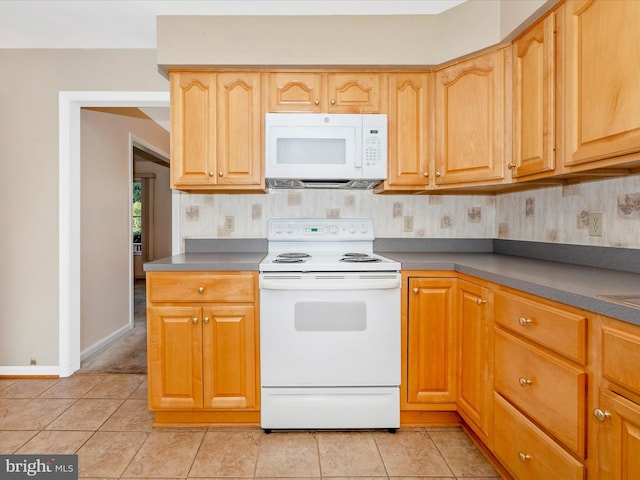 kitchen featuring white appliances, tasteful backsplash, and light tile patterned floors