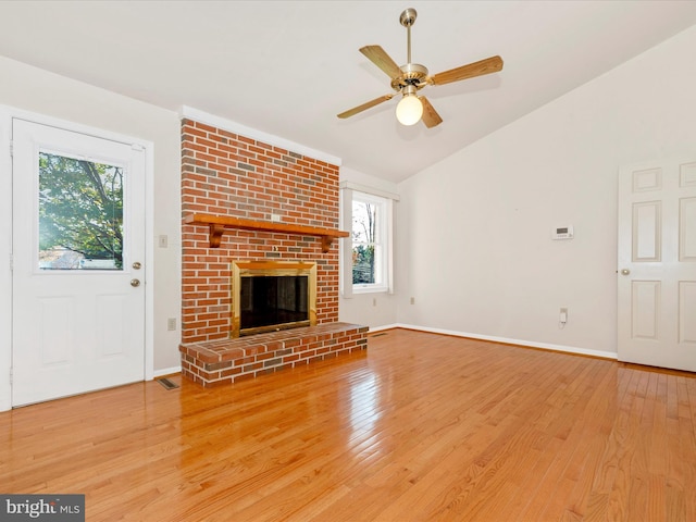 unfurnished living room featuring hardwood / wood-style flooring, plenty of natural light, and a fireplace