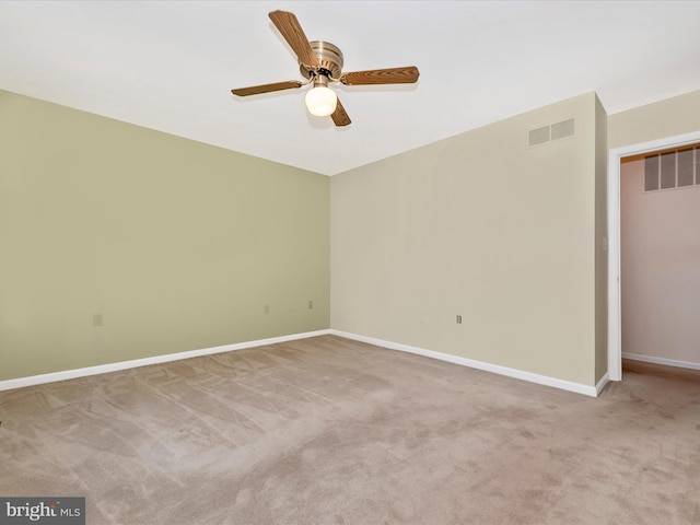 empty room with light carpet and ceiling fan