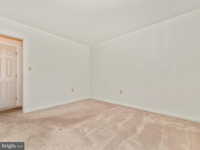 empty room with light colored carpet