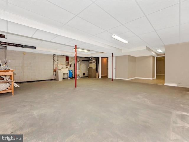 basement with a paneled ceiling