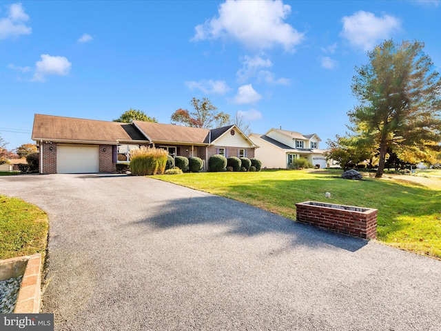 view of front of house with a front lawn and a garage