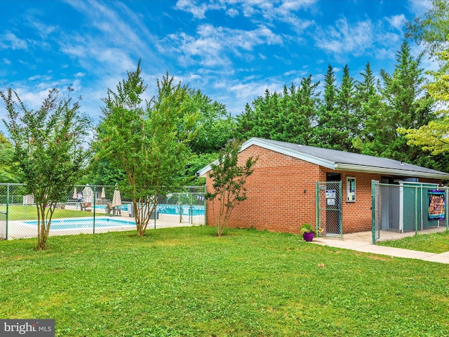 view of yard with a community pool