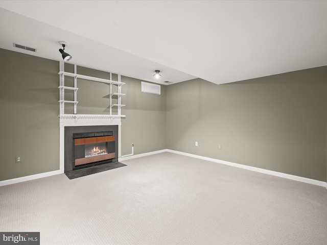 unfurnished living room featuring carpet floors