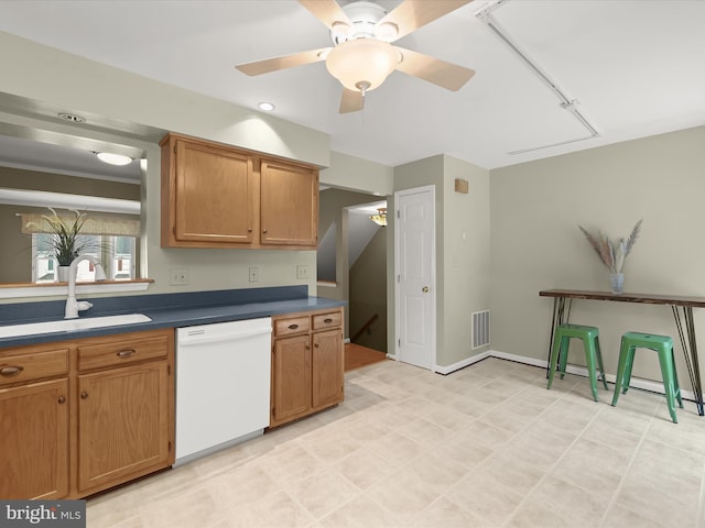 kitchen featuring sink, ceiling fan, and white dishwasher