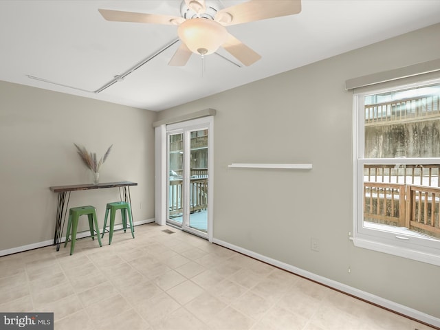 unfurnished room featuring ceiling fan