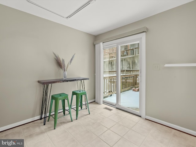 entryway with light tile patterned floors