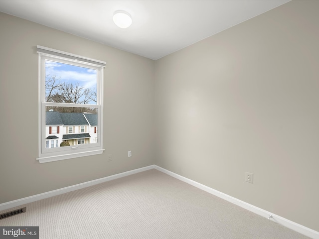 unfurnished room featuring carpet floors