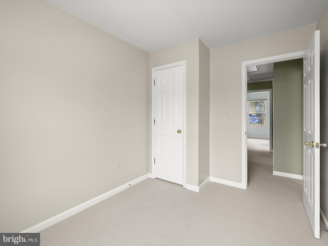 unfurnished bedroom with light carpet